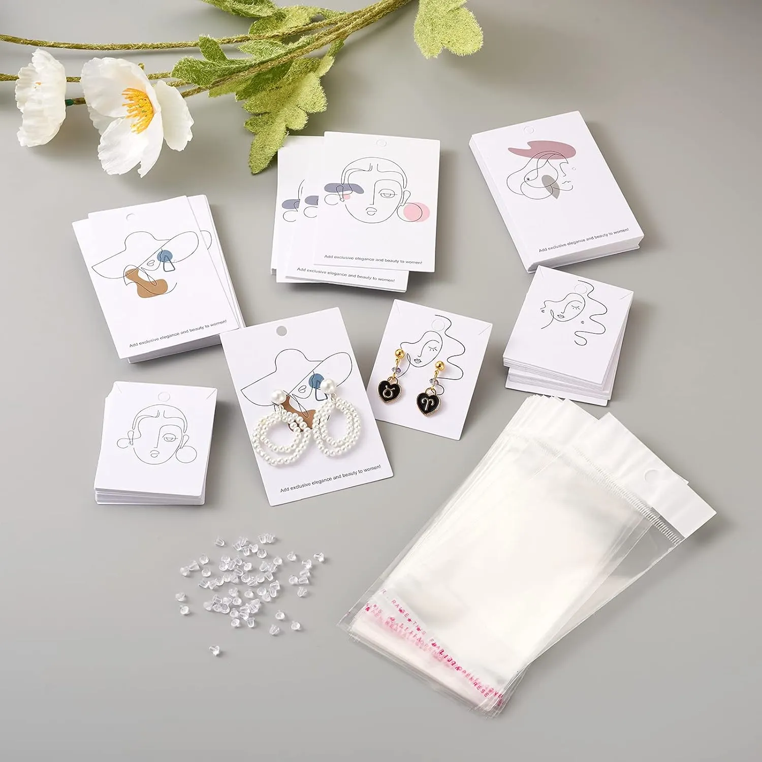 Cheriswelry 100pcs Earring Card Holder Stick Figure Pattern Earring Holder Rectangle Card Earring Holder with Pearl Film Cellophane Bags Plastic Ear Nuts for Earring Display Ear Studs Hanging Earrings