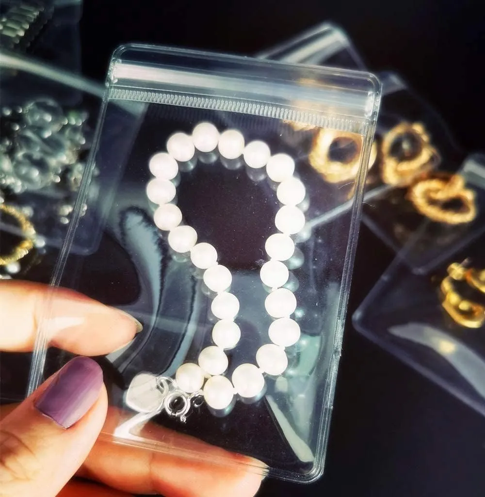 NATX 100pcs Clear PVC Transparent Zip Lock Jewelry Bag Small Size Dust Proof Airtight Pouch Plastic Zipper Self Seal Packing Organizer Storage Bags for Rings Earrings Bracelet (3.1x4.7in)