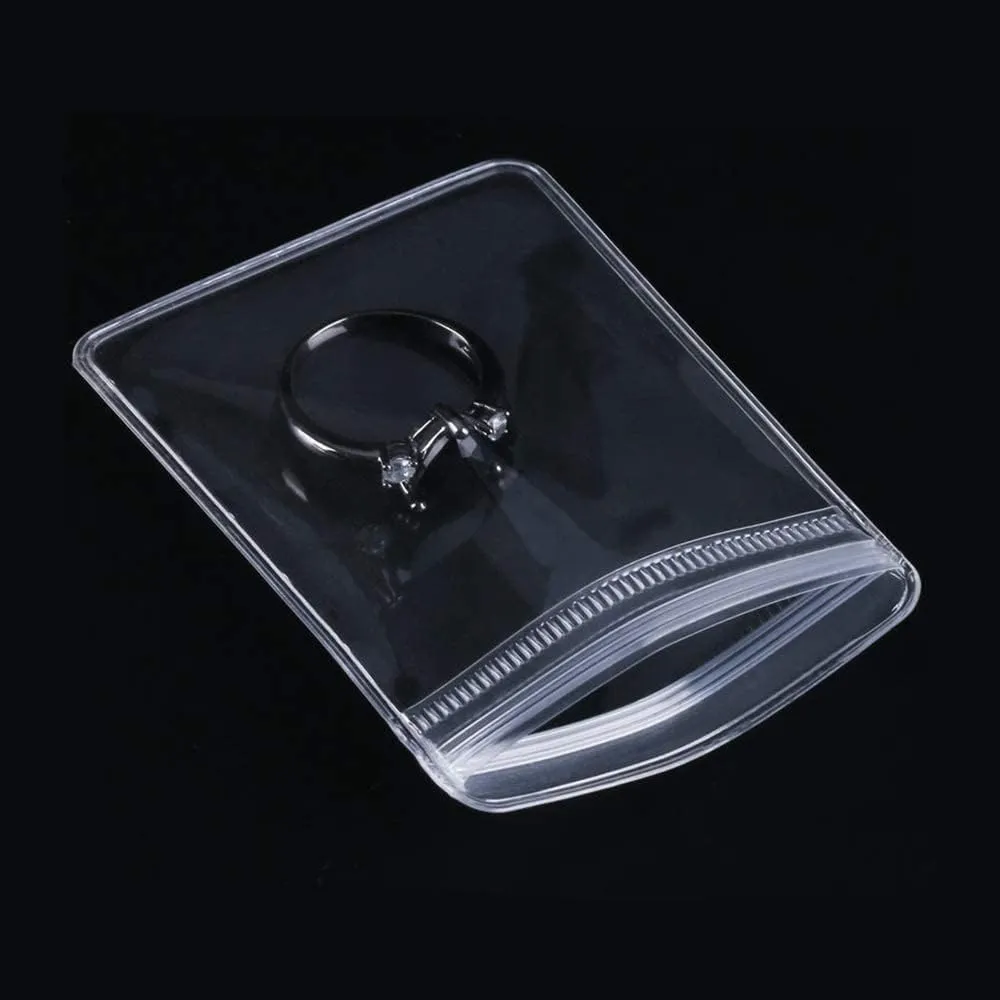 NATX 100pcs Clear PVC Transparent Zip Lock Jewelry Bag Small Size Dust Proof Airtight Pouch Plastic Zipper Self Seal Packing Organizer Storage Bags for Rings Earrings Bracelet (3.1x4.7in)